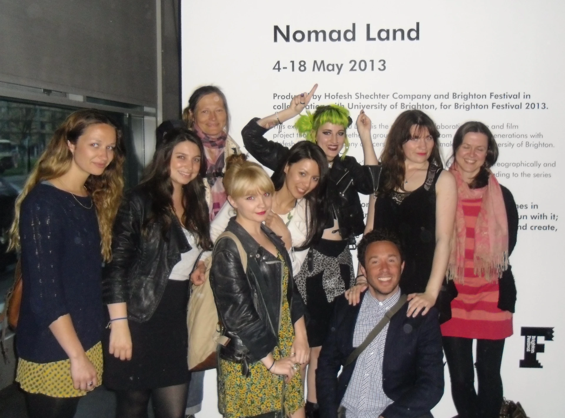 The Nomad Land project group in front of its Brighton Festival 2013 exhibition panel